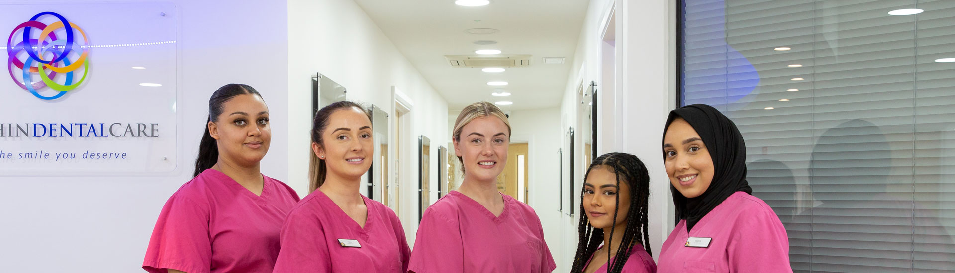 The Hitchin Dental Care nursing team in the practice corridor