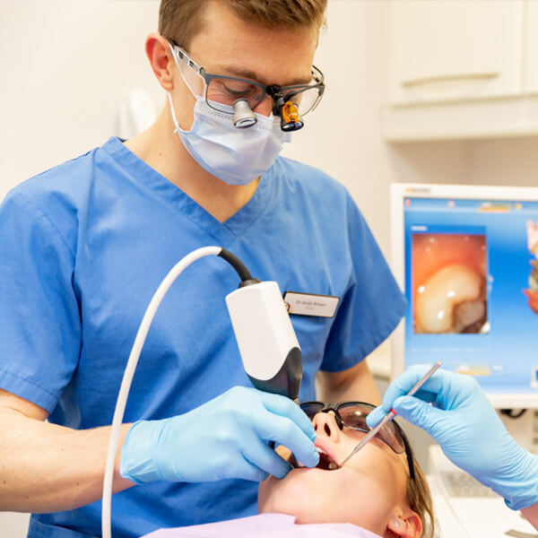 dentist carrying out specialist dental treatment