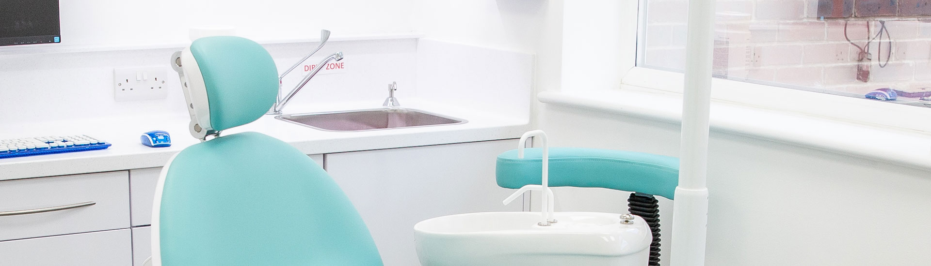 A dental chair in a bright treatment room at Hitchin Dental Care
